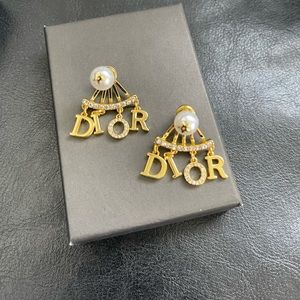 Very shiny gold small dangly earrings